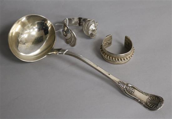 An American silver shell-pattern soup ladle, Makers R & W Wilson, Philadelphia and two white metal bangles.